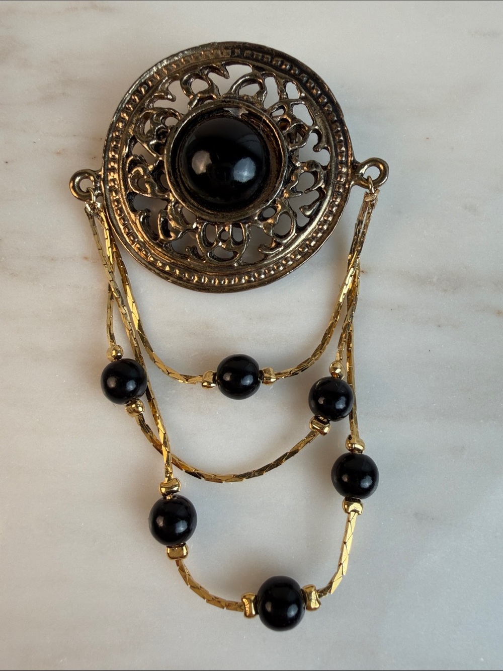 Vintage Black Cabochon Gold tone Medallion with black bead dangles Brooch